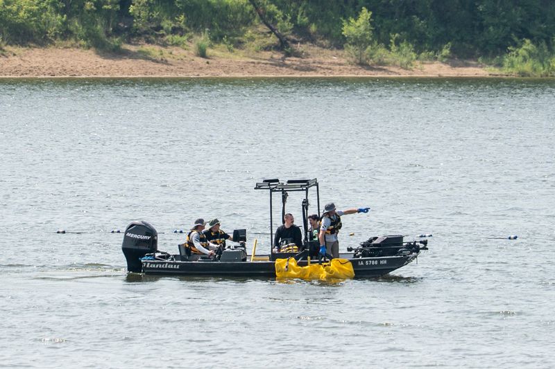 First responders recover the body of an 18-year-old male at Raccoon River Park on June 16, 2025, in West Des Moines, Iowa. The individual was reported missing Sunday evening at 5:30 p.m.