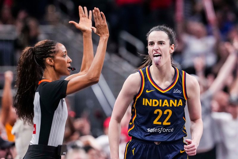 Indiana Fever guard Caitlin Clark (22) celebrates after scoring a 3-pointer Saturday, June 14, 2025, during a game between the Indiana Fever and the New York Liberty at Gainbridge Fieldhouse in Indianapolis.