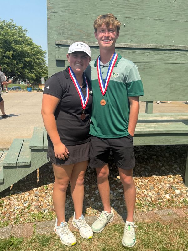 Woodward-Granger's Mallory Polito and Max Behrens pose for a photo after placing first during the Class 1A co-ed state golf meet on June 10, 2025, at the American Legion Golf Course in Marshalltown.