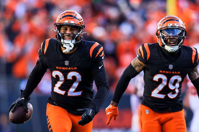 Dec 22, 2024; Cincinnati, Ohio, USA; Cincinnati Bengals safety Geno Stone (22) reacts after intercepting a pass against the Cleveland Browns in the second half at Paycor Stadium. Mandatory Credit: Katie Stratman-Imagn Images