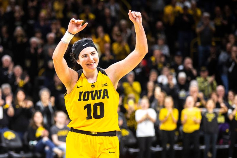 Iowa center Megan Gustafson (10) waves to fans while heading to the bench on senior day during a NCAA Big Ten Conference women's basketball game on Sunday, March 3, 2019, at Carver-Hawkeye Arena in Iowa City, Iowa.

190303 Wbb Northwestern 043 Jpg