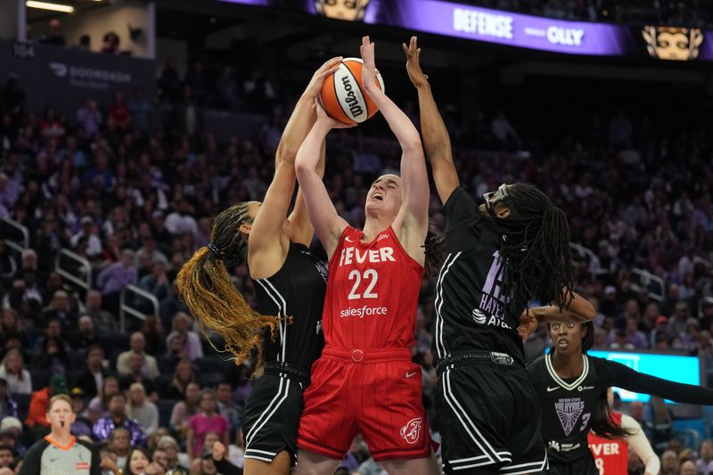 Jun 19, 2025; San Francisco, California, USA; Golden State Valkyries guard Veronica Burton (left) blocks a shot by Indiana Fever guard Caitlin Clark (22) with guard Tiffany Hayes (center right) during the fourth quarter at Chase Center. Mandatory Credit: Darren Yamashita-Imagn Images