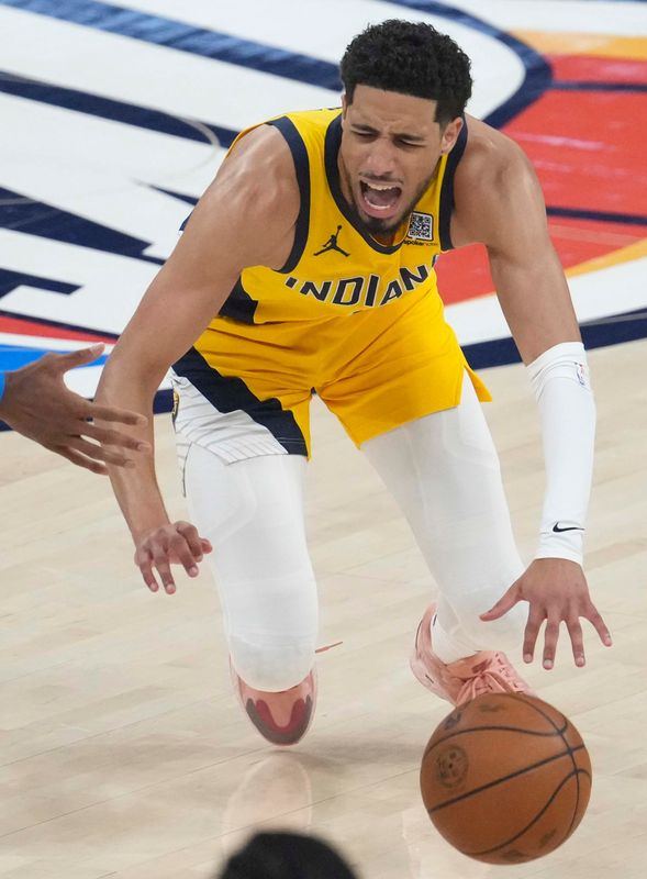 Indiana Pacers guard Tyrese Haliburton (0) goes down in pain Sunday, June 22, 2025, during Game 7 of the NBA Finals at Paycom Center in Oklahoma City.