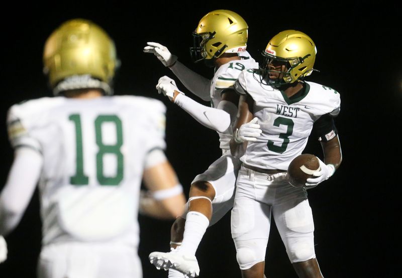 Iowa City Westâ€™s Julian Manson (3) celebrates after scoring a touchdown against Iowa City Liberty Friday, Aug. 30, 2024 in North Liberty, Iowa.