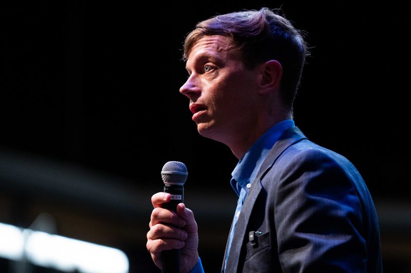 Iowa Democratic gubernatorial candidate Rob Sand fields questions from the crowd during a town hall event on June 25, 2025, at the Waukee Theatre Arts Center.