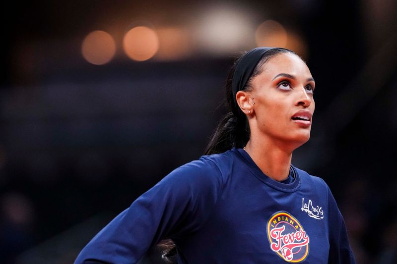 Indiana Fever forward DeWanna Bonner (25) warms up Tuesday, May 20, 2025, during a game between the Indiana Fever and the Atlanta Dream at Gainbridge Fieldhouse in Indianapolis.