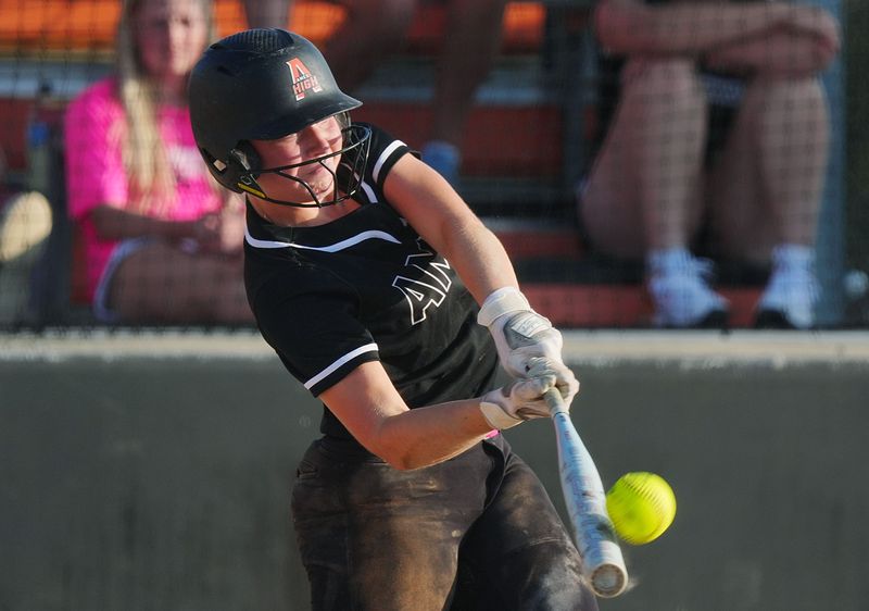 Ames' Mya Geffre (11) hits the ball against Waterloo East during the third inning in the second game of a double header at Ames High Baseball field on June 25, 2025, in Ames, Iowa