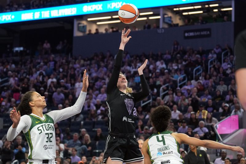 Jun 29, 2025; San Francisco, California, USA; Golden State Valkyries guard Kate Martin (center) shoots against Seattle Storm forward Alysha Clark (32) and guard Skylar Diggins (4) during the first quarter at Chase Center. Mandatory Credit: Darren Yamashita-Imagn Images