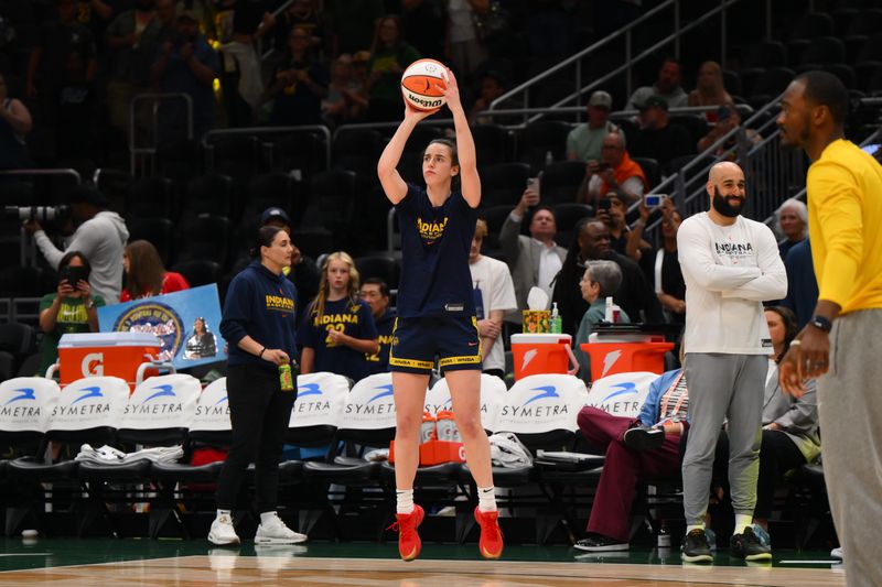 Jun 24, 2025; Seattle, Washington, USA; Indiana Fever guard Caitlin Clark (22) shoots the ball during warmups before the game against the Seattle Storm at Climate Pledge Arena. Mandatory Credit: Steven Bisig-Imagn Images