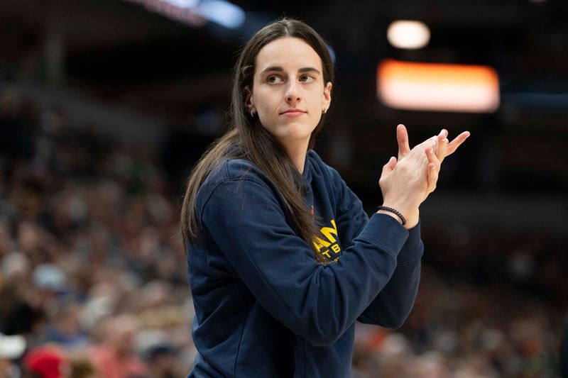 Jul 1, 2025; Minneapolis, Minnesota, USA; Indiana Fever guard Caitlin Clark (22) looks on against the Minnesota Lynx in the second half during the Commissioner's Cup final at Target Center. Mandatory Credit: Jesse Johnson-Imagn Images