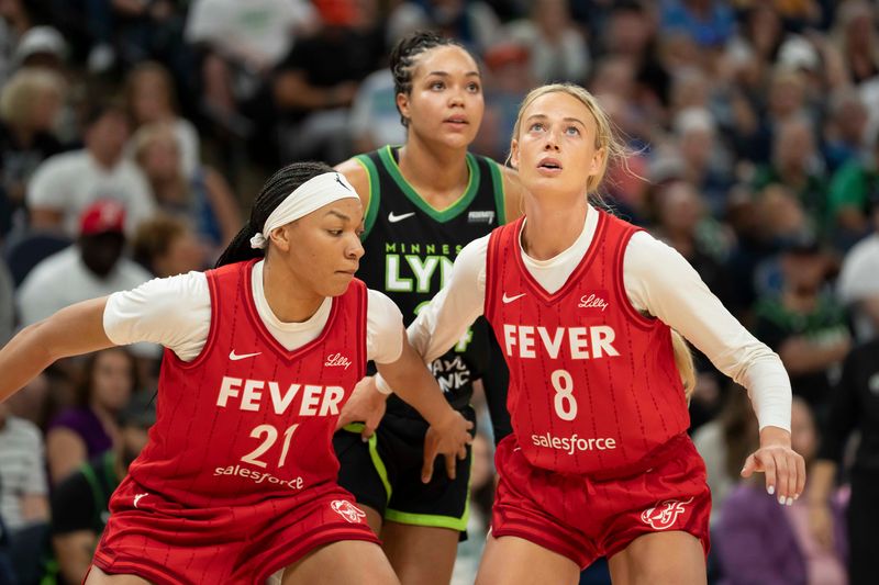 Jul 1, 2025; Minneapolis, Minnesota, USA; Indiana Fever guard Sophie Cunningham (8) and Indiana Fever forward Makayla Timpson (21) box out Minnesota Lynx forward Napheesa Collier (24) for a rebound in the second half during the Commissioner's Cup final at Target Center. Mandatory Credit: Jesse Johnson-Imagn Images