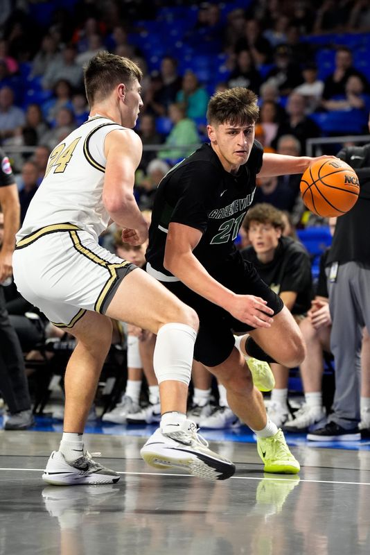Greeneville's Trey Thompson (21) bolts past Upperman's Colton Johnson (24) during the first quarter of a TSSAA Class 3A basketball state semifinal game at the Murphy Center in Murfreesboro, Tenn., Friday, March 21, 2025.