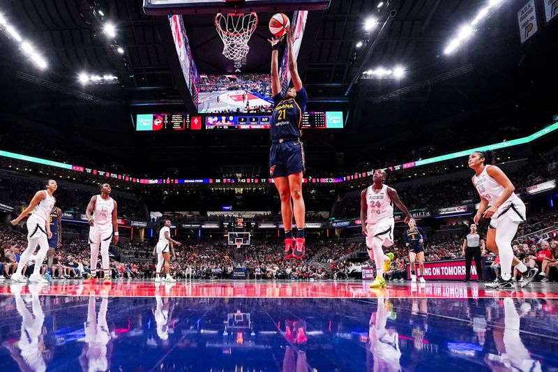 Indiana Fever forward Makayla Timpson (21) goes up for a basket Thursday, July 3, 2025, during a game between the Indiana Fever and the Las Vegas Aces at Gainbridge Fieldhouse in Indianapolis. The Indiana Fever defeated the Las Vegas Aces, 81-54.
