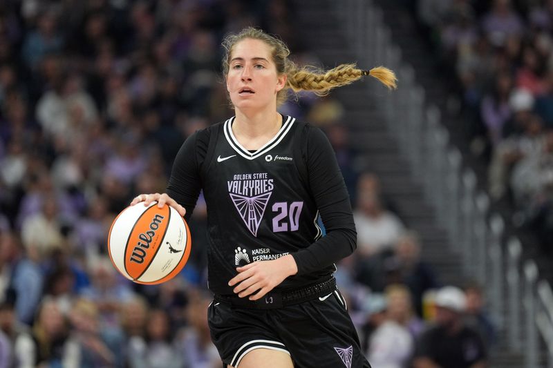 Jun 29, 2025; San Francisco, California, USA; Golden State Valkyries guard Kate Martin (20) dribbles against the Seattle Storm during the first quarter at Chase Center. Mandatory Credit: Darren Yamashita-Imagn Images