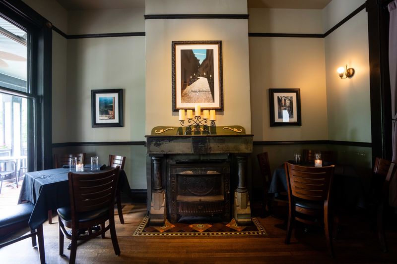 The front room at Aposto features a fireplace, making it one of the most romantic spots to dine in Des Moines.