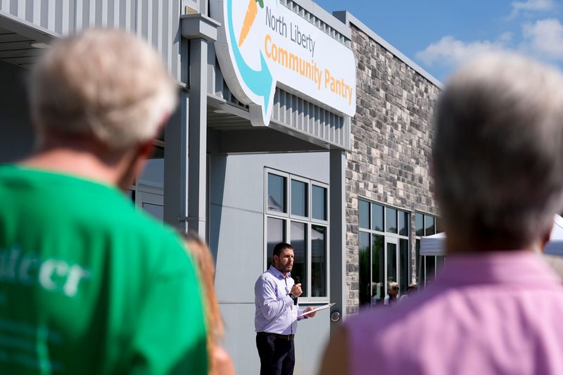Executive Director Ryan Bobst speaks during the North Liberty Community Pantry grand opening July 14, 2025 at 350 W. Penn St. in North Liberty, Iowa.