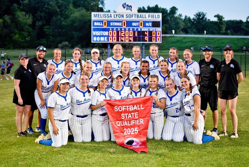 Members of the Van Meter softball team pose for a photo with the state banner after defeating Exira-EHK-Audubon in the 2A regional final on July 14, 2025, in Van Meter.