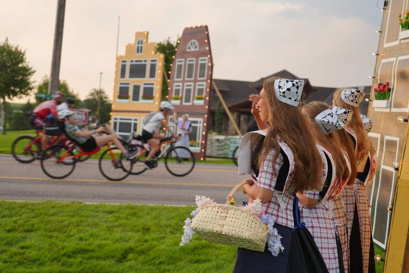 The Orange City Tulip Court waves as RAGBRAI riders roll out of Orange City to begin RAGBRAI 52 on Sunday, July 20, 2025.