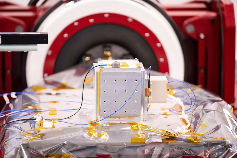 The MAGnetometers for Innovation and Capability (MAGIC) instrument – a demonstration magnetic field instrument – is prepared for vibration testing that will verify they can withstand the rigors of spaceflight in Van Allen Hall at the University of Iowa.