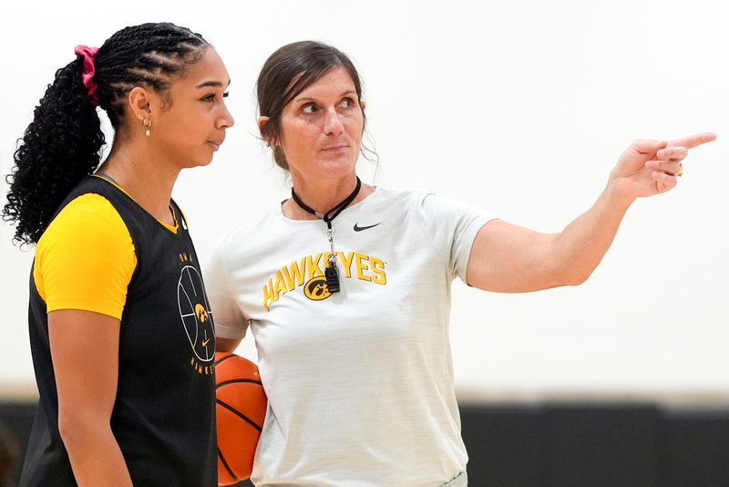 Iowa forward Hannah Stuelke talks to assistant coach Randi Henderson during a women’s basketball practice July 22, 2025 at Carver-Hawkeye Arena in Iowa City, Iowa.