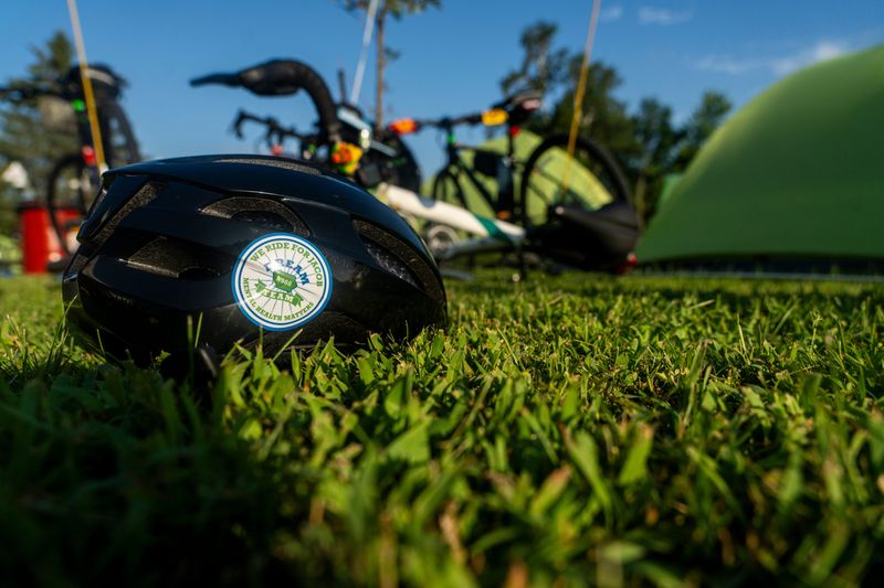 A Dream Team bike helmet with a sticker honoring Jacob Thacker. The sticker was created by Dream Team member AJ Wilson.