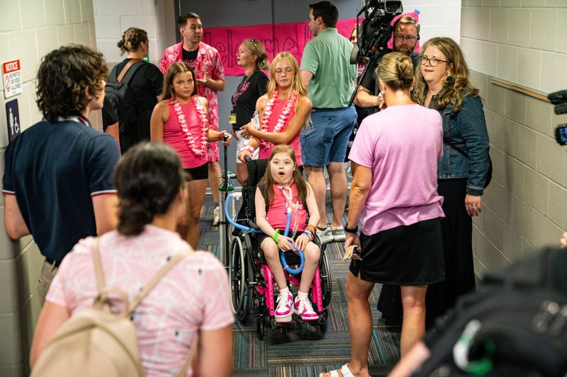Ava Weitl reacts to seeing one of her former teachers Ashleigh Wright during a fifth-grade clap out on July 23, 2025, at Eason Elementary School in Waukee, Iowa. Weitl, who was diagnosed in utero with hypoplastic left heart syndrome, spent 682 days at Mayo Eugenio Litta Children's Hospital where she received a heart and kidney transplant missing her clap out. The clap out signifies the transition from elementary to middle school. Weitl will be entering her second year of middle school as a seventh grader in the fall.