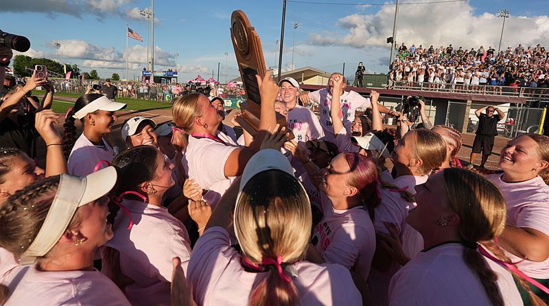 The Pella softball team celebrates after winning 4-2 over North Polk in the Class 4A state softball championship game on July 24, 2025, in Fort Dodge. The victory marked the first softball state title for the Dutch.