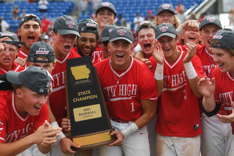 Iowa City High celebrates their win over Bettendorf during the Iowa high school state championship on Friday, July 25, 2025, at Lewis & Clark Park in Sioux City, Iowa. Iowa City High is the first school from Iowa City to win a state title championship for baseball ever.