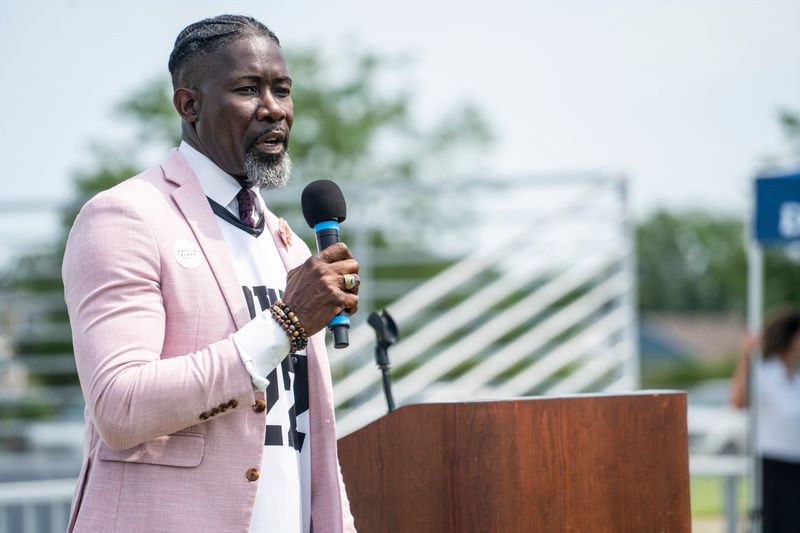 Ian Roberts speaks during a ribbon-cutting ceremony for a new outdoor basketball court at McCombs Middle School with the Caitlin Clark Foundation on July 28, 2025, in Des Moines.