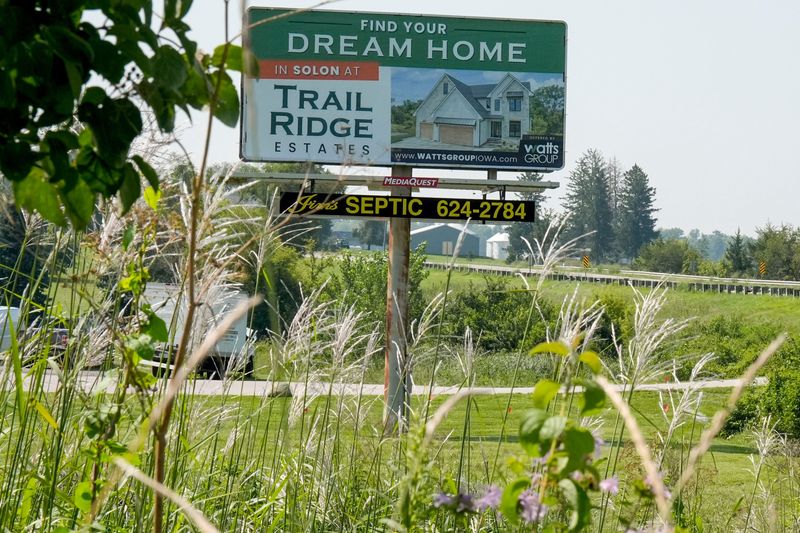 A sign advertising a new residential neighborhood is seen Aug. 1, 2025 in Solon, Iowa.