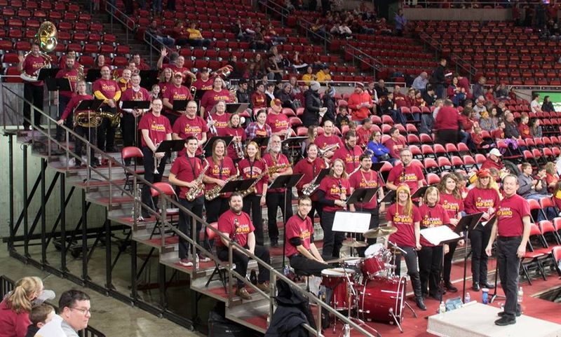 Jay Chapman, right, is the founder and conductor of the ISU Alumni Pep Band, which plays at volleyball, wrestling, gymnastics, and men's and women's basketball events at Hilton Coliseum.