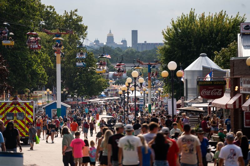 Fairgoers walk the fairgrounds during the first day of the Iowa State Fair on Aug. 7, 2025, in Des Moines.