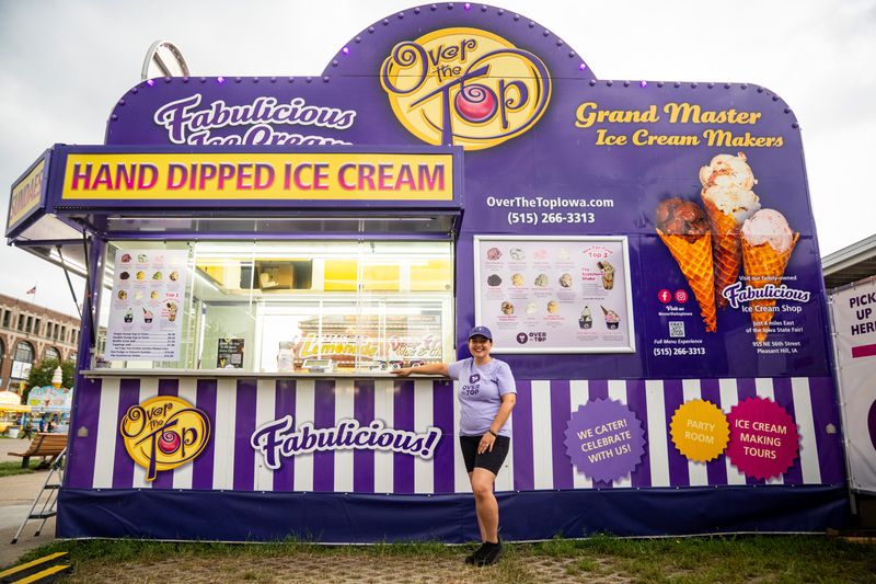 Over the Top Ice Cream owner Natalie Carroll poses for a portrait during the third day of the Iowa State Fair on Aug. 9, 2025, in Des Moines, Iowa. Over the Top Ice Cream scotcharoo shakes are one of the top new foods at the fair.