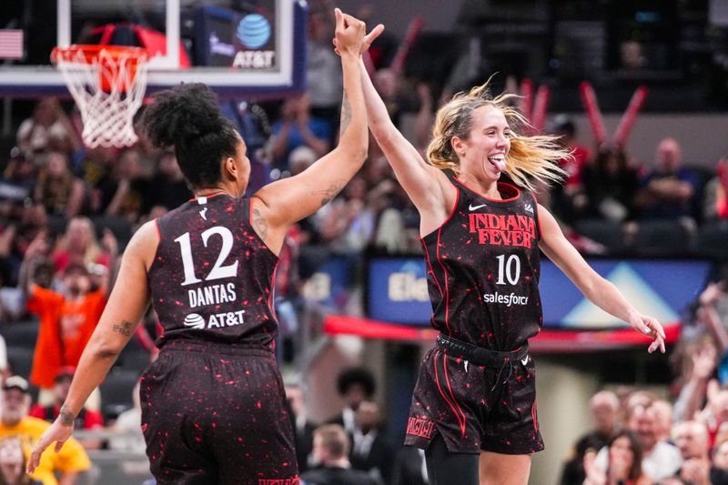 Indiana Fever forward Damiris Dantas (12) and Indiana Fever guard Lexie Hull (10) celebrate a 3-pointer during a game at Gainbridge Fieldhouse in Indianapolis.