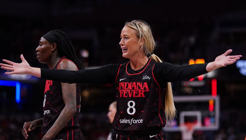 Indiana Fever guard Sophie Cunningham (8) reacts to a call from the referee on Tuesday, Aug. 12, 2025, during the game at Gainbridge Fieldhouse in Indianapolis. The Dallas Wings defeated the Indiana Fever, 81-80.
