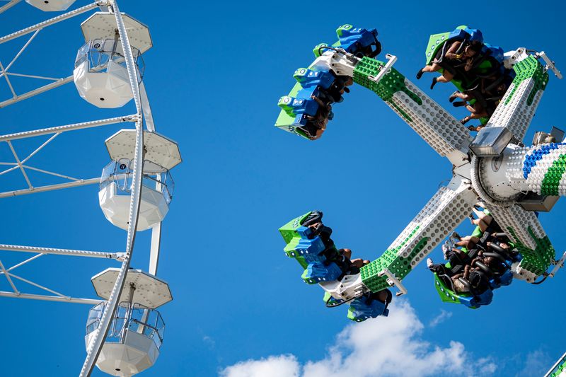 Carnival rides operate during the final and eleventh day of the Iowa State Fair on Aug. 17, 2025, in Des Moines, Iowa.