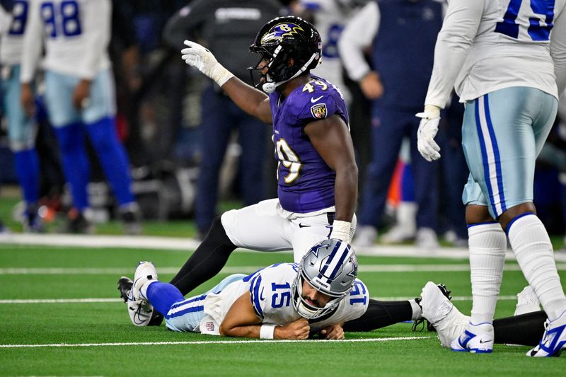 Baltimore Ravens linebacker Jay Higgins IV sacks Dallas Cowboys quarterback Will Grier.