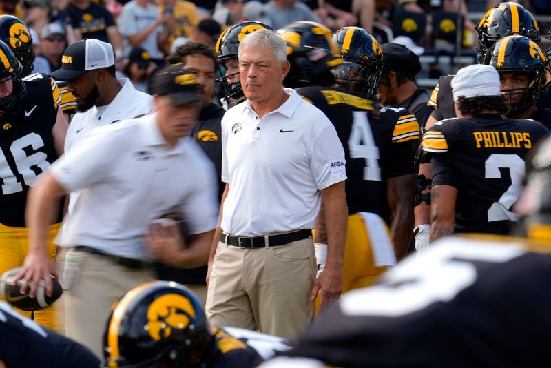 Iowa Hawkeyes head coach Kirk Ferentz watches his team warmup before playing Albany Great Danes Aug. 30, 2025 at Kinnick Stadium in Iowa City, Iowa.