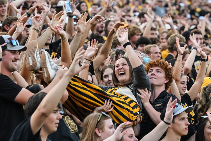 Aug 30, 2025; Iowa City, Iowa, USA; Iowa Hawkeye fans react during the second quarter against the Albany Great Danes at Kinnick Stadium. Mandatory Credit: Jeffrey Becker-Imagn Images
