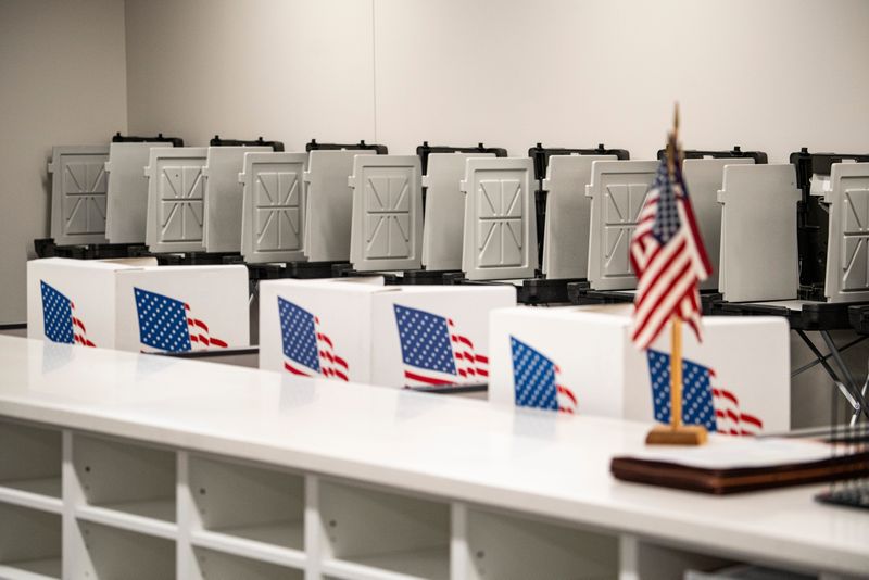 Voting booths are seen against the wall during a ribbon-cutting ceremony and tour on Sept. 3, 2025, at the new Polk County Election Office in Polk County River Place in Des Moines. The new election office replaces the closed location at Second and Court Avenue.