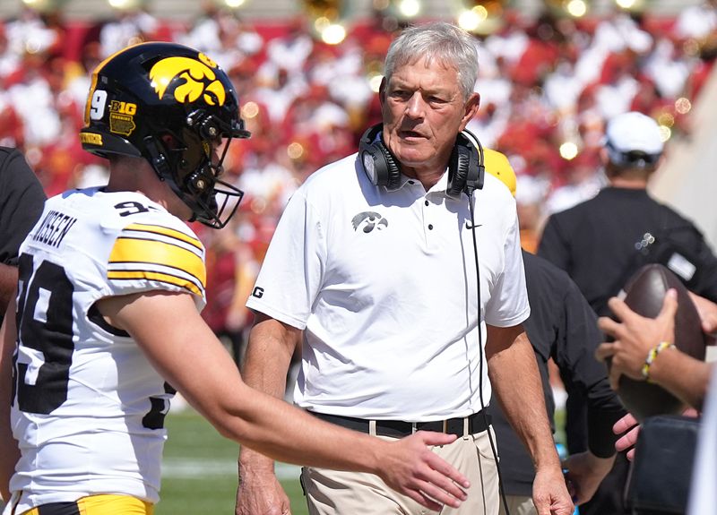 Iowa Hawkeyes head coach Kirk Ferentz talks to player during the first quarter against Iowa State in the Cy-Hawk Series at Jack Trice Stadium on Sept. 6, 2025, in Ames, Iowa