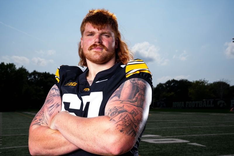 Offensive Lineman Gennings Dunker stands for a photo as Iowa Football hosts media day on Aug. 8, 2025, in Iowa City.