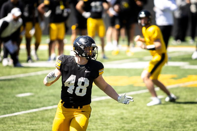 Apr 26, 2025; Iowa City, IA, USA; Iowa tight end Zach Ortwerth (48) blocks during a spring NCAA football open practice at Kinnick Stadium. Mandatory Credit: Joseph Cress/For the Register