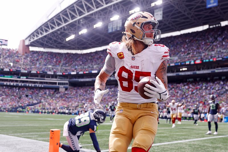 Sep 7, 2025; Seattle, Washington, USA; San Francisco 49ers tight end George Kittle (85) celebrates after scoring a touchdown during the first half against the Seattle Seahawks during the first quarter at Lumen Field. Mandatory Credit: Joe Nicholson-Imagn Images