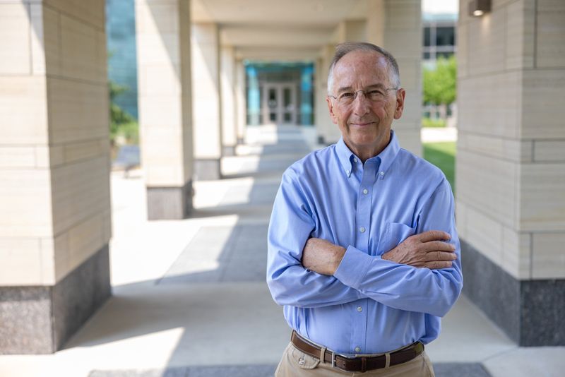 Portrait of Dr. Michael Welsh taken near the Pappajohn Biomedical Research Building on the UI Carver College of Medicine campus in 2025.