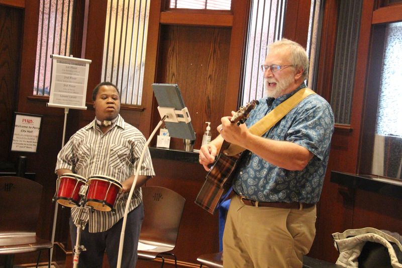 Sean and Steve Parnell perform inside the Security Bank Building during a past Art on the Prairie in Perry.