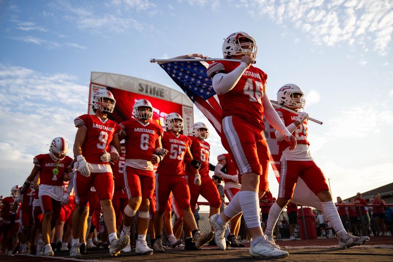 DCG football takes the field for their game against Dowling Catholic on Sept. 12, 2025, at Dallas Center-Grimes High School.