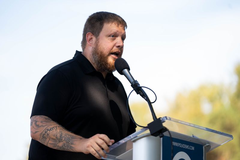 U.S. Senate candidate Nathan Sage speaks to the attendees of the 2025 Polk County Democrats Steak Fry on Sept. 13, 2025, at Des Moines Water Works Park.