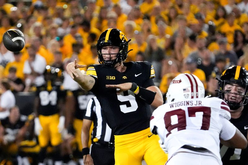 Iowa Hawkeyes quarterback Hank Brown (9) throws a pass during a football game agains the Massachusetts Minutemen Sept. 13, 2025 at Kinnick Stadium in Iowa City, Iowa.