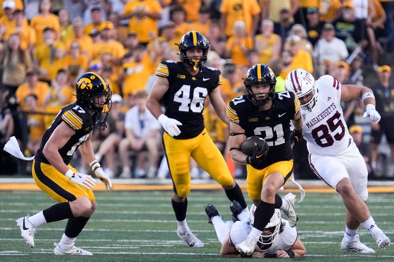 Iowa Hawkeyes wide receiver Kaden Wetjen (21) carries the ball against the Massachusetts Minutemen Sept. 13, 2025 at Kinnick Stadium in Iowa City, Iowa.